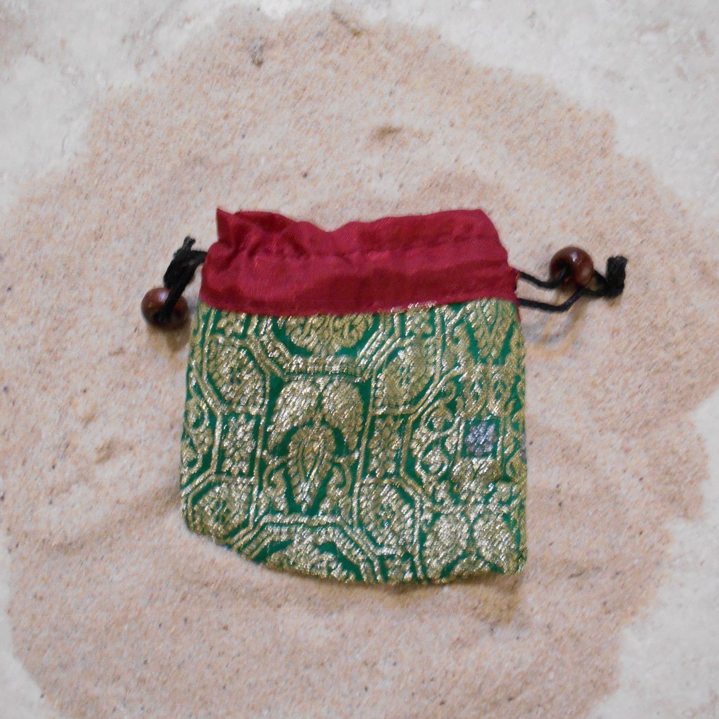 Free Silk Sari Pouch made by artisans with gold detailings and string to pull close with bead decor