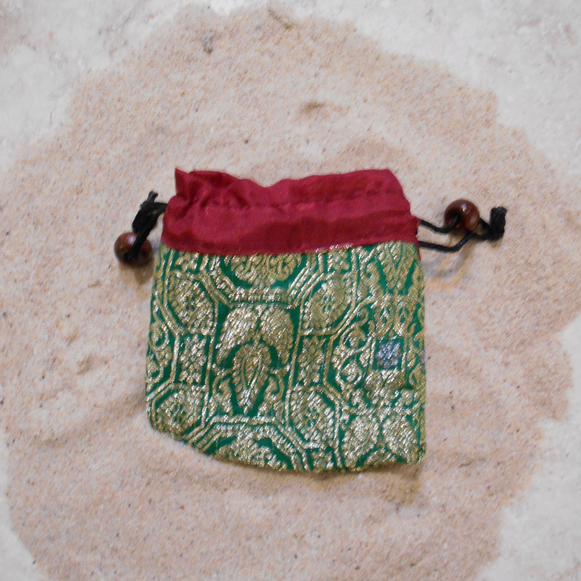 Free Silk Sari Pouch made by artisans with gold detailings and string to pull close with bead decor