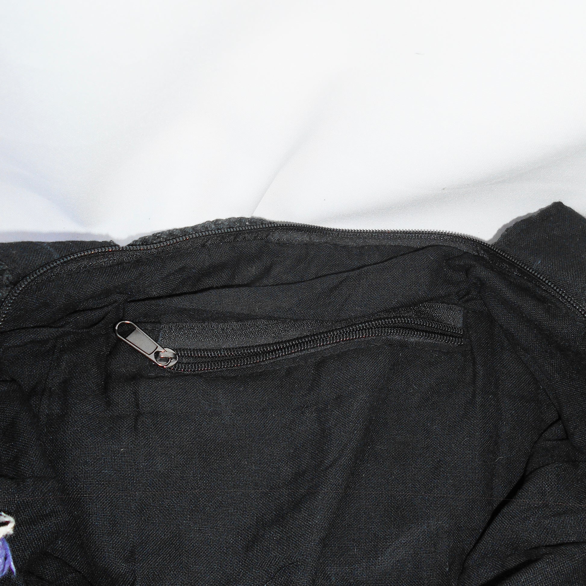 inside cotton lining of bag with zipper pocket