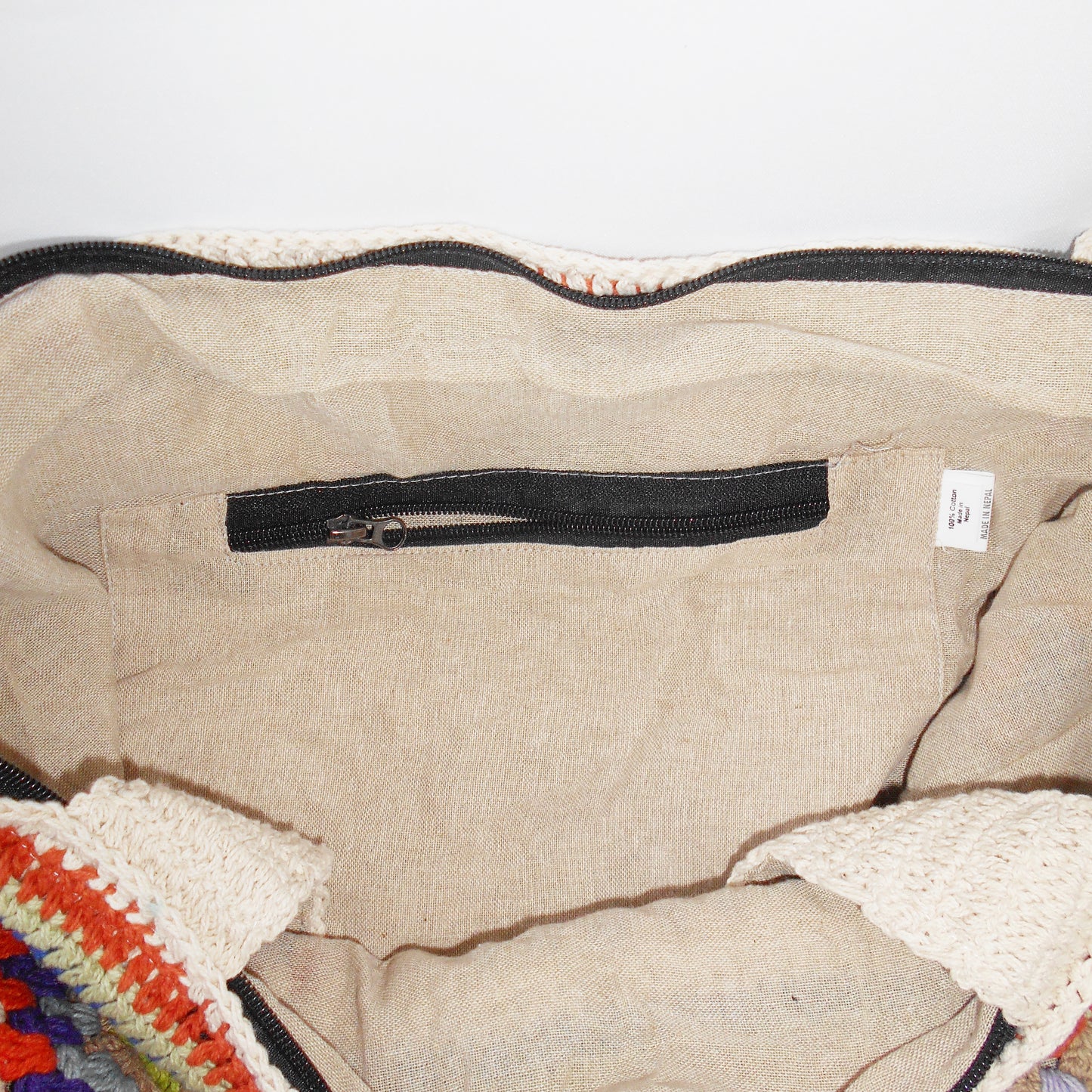 inside cotton lining of bag with zipper pocket